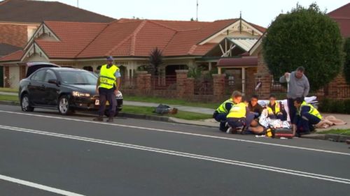 Man struck by car while changing tyre on Sydney road 