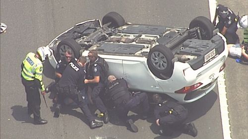 Police were quick to pounce making an arrest moments after the car flipped.