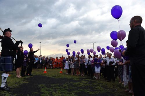 Mourners release purple balloons during Jayde's memorial service in Gatton. (Image: AAP)