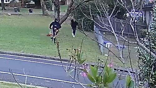 CCTV captures two men running through Colechin Reserve at Yagoona just after Mr Hamzy's murder. As one of the men flees, his hood falls from his head revealing his face and distinctive blond hair. The two men then leave the area in two luxury cars.