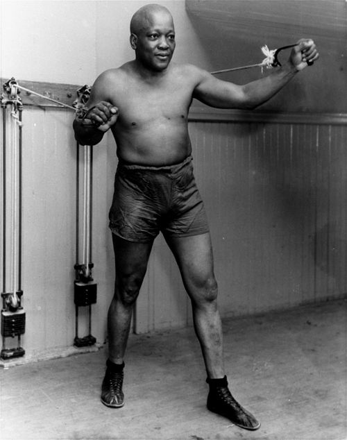  In this 1932 file photo, boxer Jack Johnson, the first black world heavyweight champion, poses in New York City. Black athletes have been finding a way to fight for social change for more than 100 years, from Jack Johnson, to Muhammad Ali to Kaepernick. (AP Photo/File)