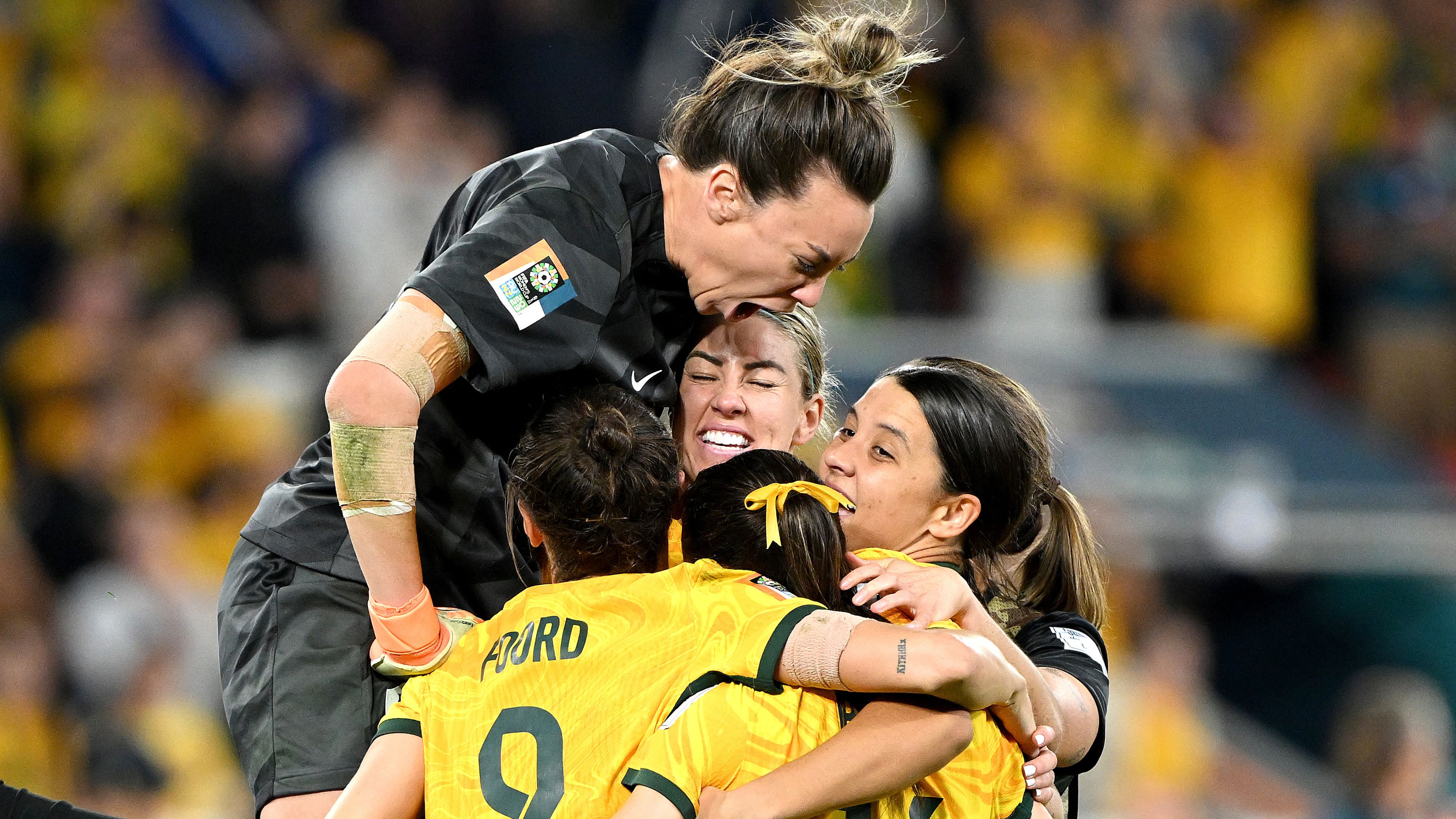 BRISBANE, AUSTRALIA - AUGUST 12: Mackenzie Arnold of Australia celebrates with her team mates after Cortnee Vine of Australia scores her team&#x27;s tenth penalty in the penalty shoot out during the FIFA Women&#x27;s World Cup Australia &amp; New Zealand 2023 Quarter Final match between Australia and France at Brisbane Stadium on August 12, 2023 in Brisbane, Australia. (Photo by Bradley Kanaris/Getty Images)