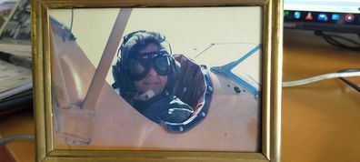 Erica during a flight for her 60th birthday in a Tiger Moth airplane.