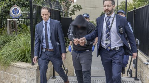 Two men have been charged with the murder of elderly Sydney man Kalim Saliba.