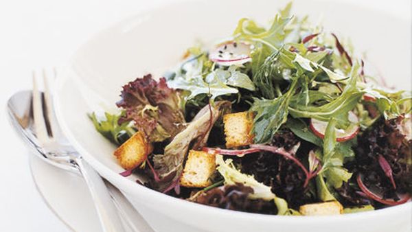 Salad farm lettuces with radishes, baby croutons and citrus vinaigrette