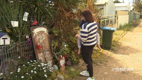 Relatives still lay tributes for the murdered grandmother.