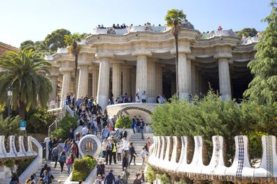 A large group of tourists in the Park Guell, one of the most famous sights in Barcelona, Catalonia, Spain 2019-05-01.