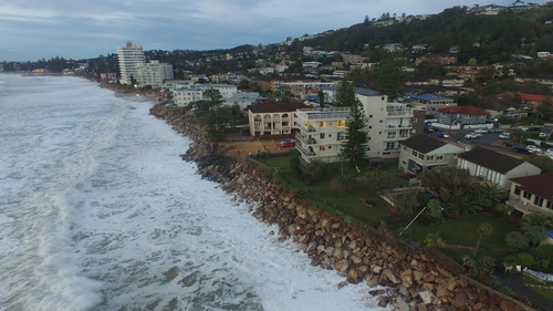 Storms and pounding waves fuelled by the La Niña weather event has swallowed much of the golden sand, leaving houses teetering precariously over water. 