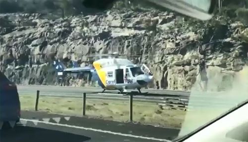 The Careflight helicopter landed on southbound lanes of the major motorway after the incident, closing all three lanes. Picture: Supplied.