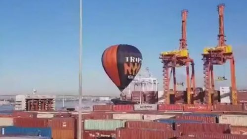 The pilot aimed for Royal Park in Parkville before a sudden change in wind pushed the balloon towards the Appleton docks in Melbourne Harbour.