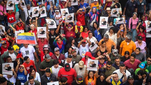 Supporters of Maduro march in Caracas in support of the ousted president.