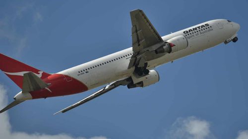Qantas flight delayed by on board protest over asylum seeker's deportation