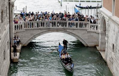 Venice overtourism: bridge crowded with tourists