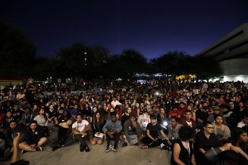 Students from University of Nevada Las Vegas hold a vigil. (AAP)