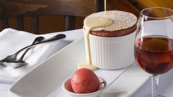 Bistro Moncur's mandarin soufflé with vanilla bean anglaise and mandarin sorbet. Image: Bistro Moncur