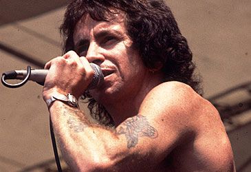 What instrument did Bon Scott play on 'It's a Long Way to the Top'?