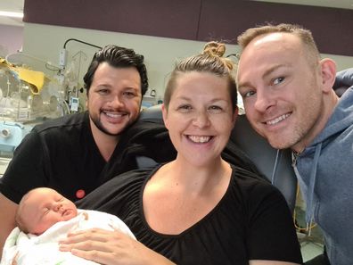 Lunaria Gaia with Joel and Dan after giving birth to baby Archer.