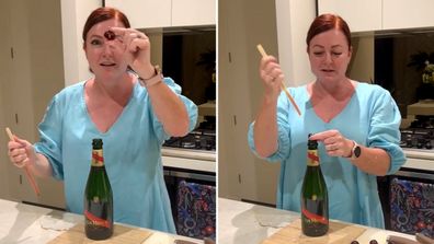 Shelly Horton demonstrates how to pit cherries with a wine bottle