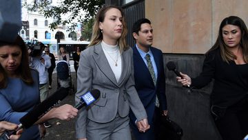 Hannah Quinn (2nd from left) and Blake Davis (2nd from right) arrive at NSW Supreme Court in Darlinghurst, Sydney, NSW. 16th March, 2021. Photo: Kate Geraghty