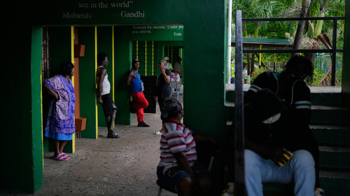 People take shelter at a school ahead of Hurricane Melissa's forecast arrival in Old Harbour, Jamaica, Monday, Oct. 27, 2025. (AP Photo/Matias Delacroix)