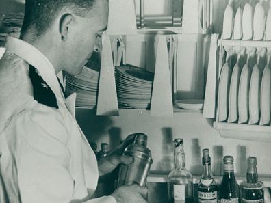 A flight attendant in the Empire Airlines galley in 1938.