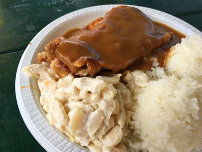 Plate dinners - chicken and rice with gravy all over and macaroni salad from Rainbow Drive-In