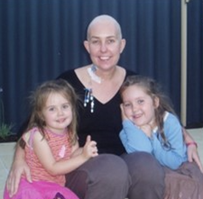 Sarah Lukeman with her young daughters during her cancer treatment.
