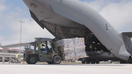 Pallets of supplies are being unloaded at the International Airport in Tonga. 