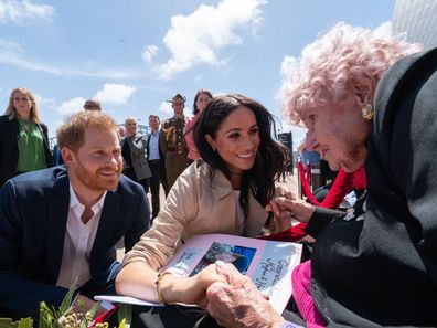 Prince Harry, Duke of Sussex and Meghan, Duchess of Sussex greet Daphne Dunne at the Sydney Opera House on October 16, 2018.