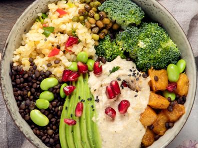 Vegan dishes assortment on light background. Mediterranean diet concept. Flat lay, top view