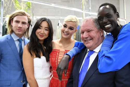 Robert Doyle poses for photos with the ambassadors of Melbourne Spring Fashion Week last year. (AAP)