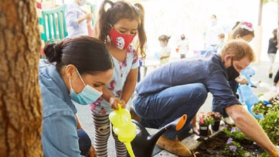 Harry and Meghan joined the children to plant forget-me-nots and vegetables.