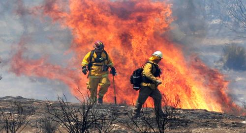 Raging wildfire engulfs California homes, film set