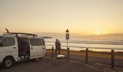 Shot of a young couple admiring the view at the beach while on a roadtrip
