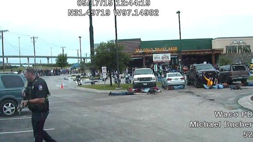  This image from a May 17, 2015 police Dash-cam video shows the the scene in a parking lot of Twin Peaks restaurant after a shooting between two rival biker gangs in Waco, Texas. (Waco police via AP)