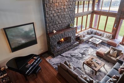Spicers Peak Lodge living area with stone fireplace