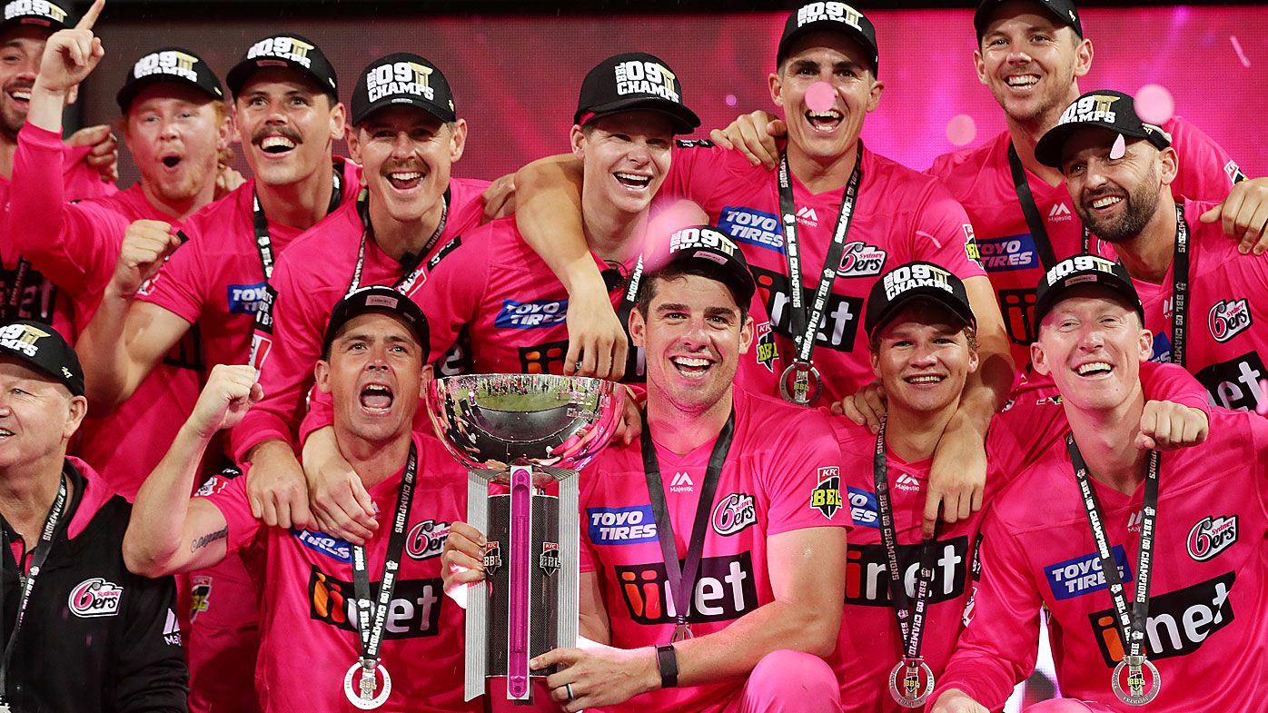 The Sixers pose with the trophy after winning the Big Bash League Final match