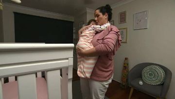 Sara Humphries settles her daughter Layla. Picture: 9NEWS