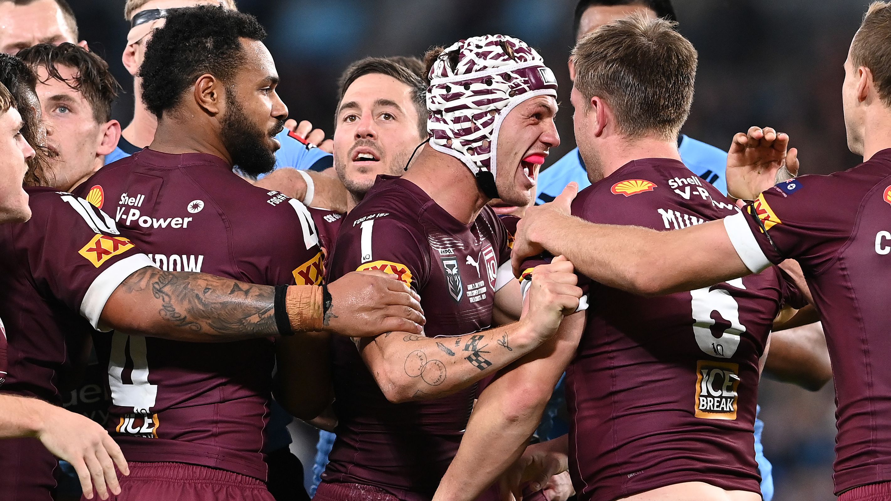 Maroons players celebrate a try during the 2021 Origin series.