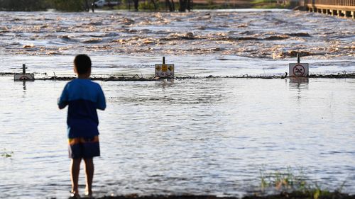 The swollen Balonne river gushes under the Jack Taylor weir in St George, south-western Queensland.