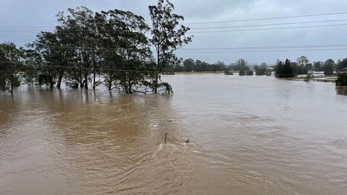 Flooding is seen next to the Pacific Highway in Bulahdelah, NSW.