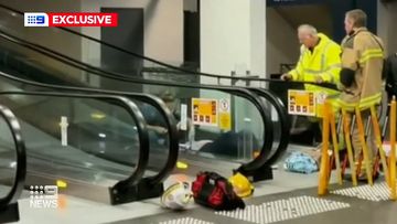 Woman trapped in escalator robbed while she waited to be freed