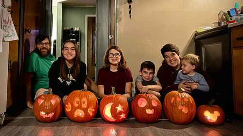 The Ratner family, here celebrating Halloween in 2022 in their home in East Palestine, Ohio, worries about the longer-term risks that environmental officials are only beginning to assess.