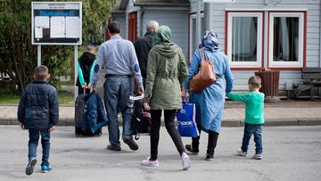 Refugees from Syria arrive at the Friedland shelter near Goettingen, central Germany, on April 4, 2016, after arriving from Turkey at the airport in Hanover. (AFP)
