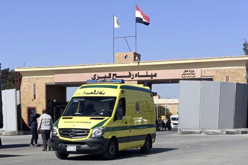 An ambulance carrying bodies of the foreign humanitarian aid workers killed in a recent Israeli airstrike in Gaza crosses the Rafah border crossing between Egypt and the Gaza Strip, Wednesday, April 3, 2024. 