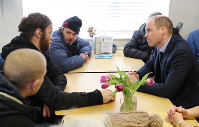 Prince William speaks with service users during a visit to The Beacon, a day centre which gives support to the homeless and vulnerable people.