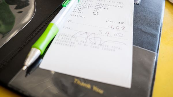 Credit card bill and pen in a restaurant