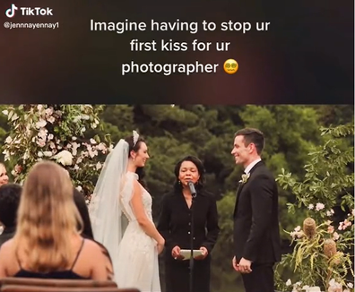 Wedding photographer interrupts couple mid first-kiss