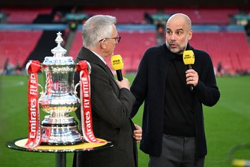 Gary Lineker speaks to Pep Guardiola after Manchester City&#x27;s victory.