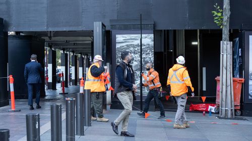 Workers outside the Reserve Bank of Australia.